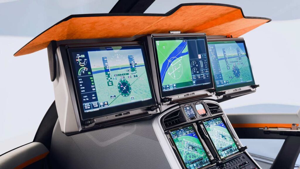 Panel de instrumentos del helicóptero Robinson R88 con aviónica Garmin G500H TXi, mostrando múltiples pantallas de navegación y sistemas de vuelo avanzados.